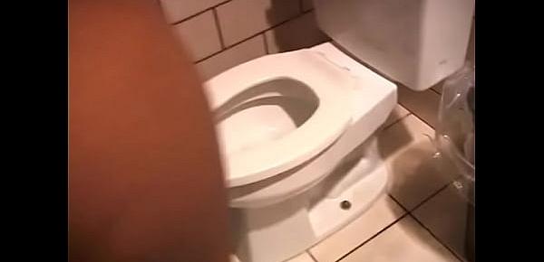  Chubby ebony brunettes caress each other and take turns pissing in the toilet